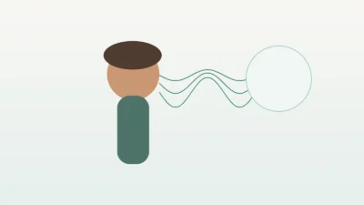Adult softly humming during a relaxed exhale, representing the evidence-aware use of humming in a vagus routine.