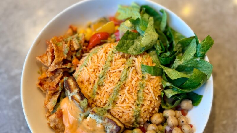 Salmon, walnuts, ground flaxseed, chia seeds, edamame and leafy greens arranged as food sources of omega-3 fats.