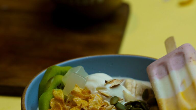 Yogurt with fruit, nuts and seeds illustrating small nutrient-dense glp-1 snack ideas