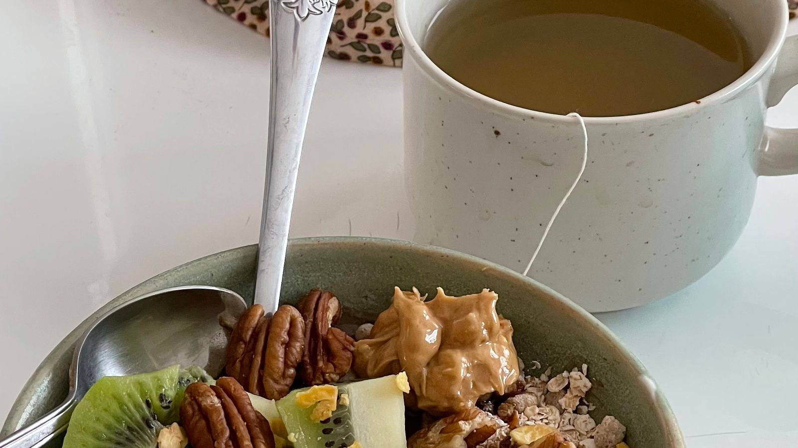 Kiwi, granola and nuts illustrating fiber-rich foods that may help with GLP-1 constipation